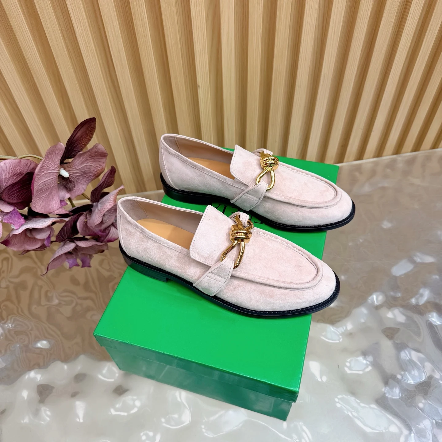 Bottega Veneta Metallic twisted shoes and loafers.