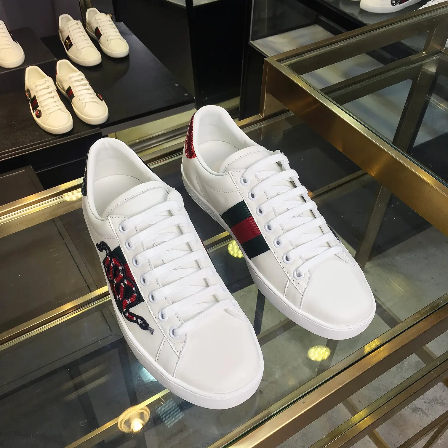 Gucci Couple s embroidered canvas white sneakers